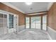 Office with natural light, marble tile floors, and adjacent shelving at 2983 Crosswycke Forest Dr, Brookhaven, GA 30319