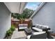 Outdoor patio with furniture features privacy screen and space for entertaining at 2983 Crosswycke Forest Dr, Brookhaven, GA 30319