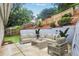 Back patio featuring outdoor furniture with tiered garden and privacy fence at 2983 Crosswycke Forest Dr, Brookhaven, GA 30319