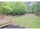 Wooden deck overlooking a lawn and trees at 87 Davis Mill Ct, Lawrenceville, GA 30044