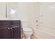 This bathroom includes a shower-tub combination and a dark brown vanity at 87 Davis Mill Ct, Lawrenceville, GA 30044