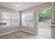 Bedroom featuring hardwood flooring and an open door to a private deck for outdoor relaxation at 87 Davis Mill Ct, Lawrenceville, GA 30044