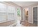 Bright bedroom with large window, hardwood floors, and access to a private balcony at 87 Davis Mill Ct, Lawrenceville, GA 30044