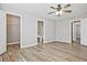 This bedroom features hardwood floors, neutral walls, and a ceiling fan at 87 Davis Mill Ct, Lawrenceville, GA 30044