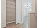 Walk-in closet with shelving and hardwood floors at 87 Davis Mill Ct, Lawrenceville, GA 30044