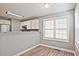 Inviting dining area with modern lighting and hardwood floors, adjacent to the kitchen at 87 Davis Mill Ct, Lawrenceville, GA 30044