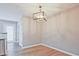Bright dining area with stylish light fixture and hardwood flooring, ideal for entertaining at 87 Davis Mill Ct, Lawrenceville, GA 30044