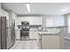 Well-equipped kitchen with stainless steel appliances, granite countertops, and tile backsplash at 87 Davis Mill Ct, Lawrenceville, GA 30044
