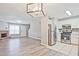 Inviting living room featuring a fireplace, wood floors, and lots of natural light coming from the window at 87 Davis Mill Ct, Lawrenceville, GA 30044