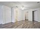 Main bedroom with hardwood floors, fan, ensuite bathroom, and walk-in closet at 87 Davis Mill Ct, Lawrenceville, GA 30044