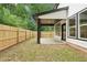 Backyard with a covered patio and fenced yard, perfect for outdoor living and entertaining at 1158 Welch Sw St, Atlanta, GA 30310