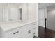 Bathroom showcasing white cabinets, black hardware, and an open view to the hallway at 1158 Welch Sw St, Atlanta, GA 30310