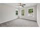 Bedroom with plush carpet, bright windows, and a ceiling fan at 1158 Welch Sw St, Atlanta, GA 30310