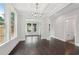 Dining area with hardwood floors, coffered ceiling, and adjacent bathroom at 1158 Welch Sw St, Atlanta, GA 30310