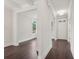 Bright foyer featuring dark wood floors, white walls, and a modern ceiling light fixture at 1158 Welch Sw St, Atlanta, GA 30310