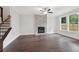 Inviting living room showcasing a stone fireplace, hardwood floors, and natural light at 1158 Welch Sw St, Atlanta, GA 30310