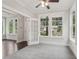 Cozy living room with plush carpeting, large windows, and a glass paneled door at 1158 Welch Sw St, Atlanta, GA 30310