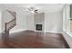 Modern living room with a stone fireplace, hardwood floors, and staircase at 1158 Welch Sw St, Atlanta, GA 30310