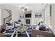Bright living room featuring a stone fireplace, ceiling fan and comfortable seating at 1158 Welch Sw St, Atlanta, GA 30310