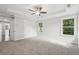 Spacious main bedroom features plush carpet, a ceiling fan, and bright natural light at 1158 Welch Sw St, Atlanta, GA 30310
