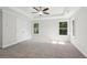 Bright primary bedroom boasts large windows and a tray ceiling at 1158 Welch Sw St, Atlanta, GA 30310