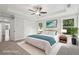 Light-filled main bedroom with tray ceiling, fan, ensuite bath, and ample closet space at 1158 Welch Sw St, Atlanta, GA 30310