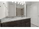 Bathroom features a double sink vanity with granite countertop and modern fixtures at 310 Rose Garden Ln, Alpharetta, GA 30009