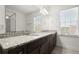 Bright bathroom featuring double sinks and granite countertops at 310 Rose Garden Ln, Alpharetta, GA 30009