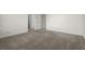 Neutral bedroom with plush carpet and ample closet space at 310 Rose Garden Ln, Alpharetta, GA 30009