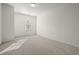 Spacious bedroom features neutral carpet, white walls, and a bright window at 310 Rose Garden Ln, Alpharetta, GA 30009