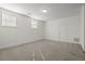 Second story bedroom with neutral carpet, two windows and a door at 310 Rose Garden Ln, Alpharetta, GA 30009