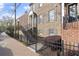 A well-maintained home with a brick facade, gray shutters, and manicured landscaping creates curb appeal at 310 Rose Garden Ln, Alpharetta, GA 30009