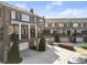 Charming townhomes feature inviting balconies, attached garages, and professionally maintained landscaping at 310 Rose Garden Ln, Alpharetta, GA 30009