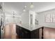 Kitchen island with granite countertop, stainless steel appliances, and hardwood floors at 310 Rose Garden Ln, Alpharetta, GA 30009