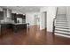 Modern kitchen with dark cabinets, stainless steel appliances, and central island at 310 Rose Garden Ln, Alpharetta, GA 30009