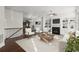 A bright living room with hardwood floors, a fireplace, and built-in bookshelves showcases a comfortable sitting area at 310 Rose Garden Ln, Alpharetta, GA 30009