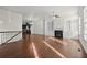 Open-concept living room featuring hardwood floors, fireplace with built-ins, and abundant natural light at 310 Rose Garden Ln, Alpharetta, GA 30009