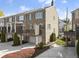 The rear exterior displays decks on multiple levels and attached garages for convenient parking at 310 Rose Garden Ln, Alpharetta, GA 30009
