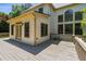 Inviting back deck featuring multiple doors entering the home and a wood railing at 3175 Lake Seminole Pl, Buford, GA 30519