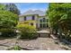 The home's backyard features a wooden deck and many windows bringing natural light into the home at 3175 Lake Seminole Pl, Buford, GA 30519