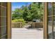 Outdoor deck overlooking a meticulously landscaped backyard with a garden and privacy fence at 3175 Lake Seminole Pl, Buford, GA 30519