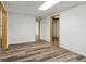 Unfinished basement with wood look floors, white walls, and neutral doors offers a clean slate for flexible design at 3175 Lake Seminole Pl, Buford, GA 30519