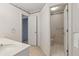 A well-lit bathroom features decorative wallpaper and a convenient layout at 3175 Lake Seminole Pl, Buford, GA 30519