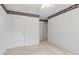 Bedroom features white walls, two doors and neutral carpet at 3175 Lake Seminole Pl, Buford, GA 30519