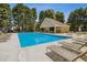 Large community pool with lounge chairs and a covered area, ideal for relaxation and recreation at 3175 Lake Seminole Pl, Buford, GA 30519