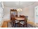 Elegant dining room featuring hardwood floors, a chandelier, and classic decor at 3175 Lake Seminole Pl, Buford, GA 30519