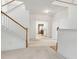 Hallway with hardwood floor accents, leading to other rooms of the home at 3175 Lake Seminole Pl, Buford, GA 30519