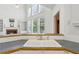 Bright kitchen featuring a sink, large windows, and access to the great room at 3175 Lake Seminole Pl, Buford, GA 30519