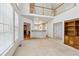 Bright living room with ample natural light and an open view to the dining area at 3175 Lake Seminole Pl, Buford, GA 30519