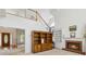 Open-concept living room showcasing a fireplace, staircase, and ample natural light at 3175 Lake Seminole Pl, Buford, GA 30519